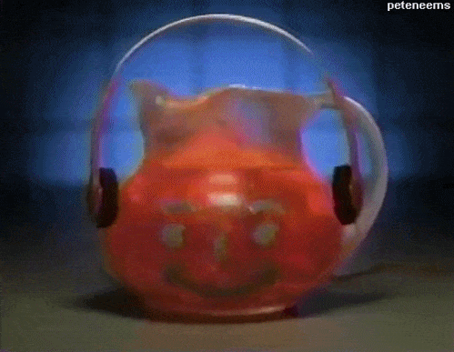 The Kool-Aid Man, Pitcher thing, whatever, dancing to music from headphones.