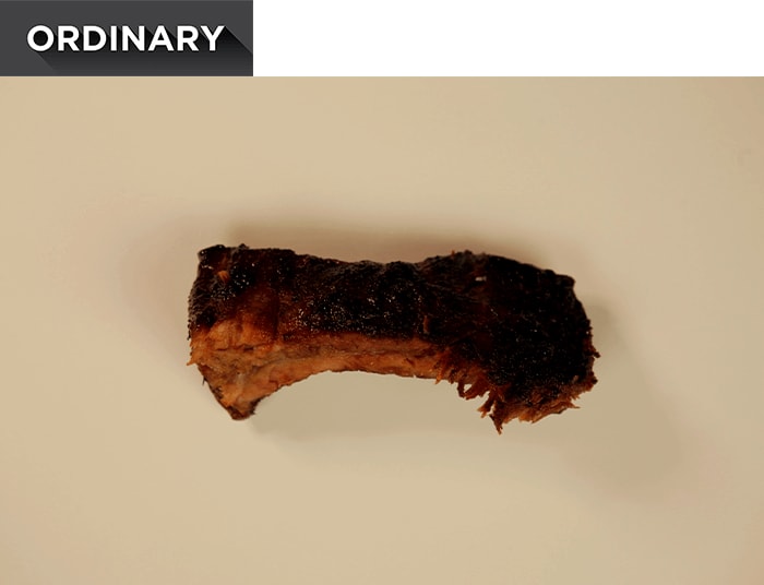 A single, cooked spare rib.