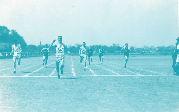 Racers running past the finish line.